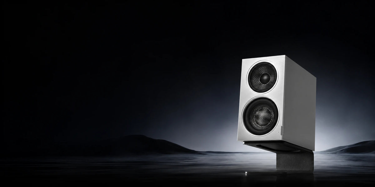 MiniMax3 Monitor in silver on its desk stand, lit against a dark horizon
