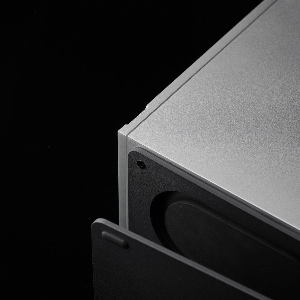 Concealed passive radiator beneath the silver SOVOX MiniMax3 Monitor cabinet