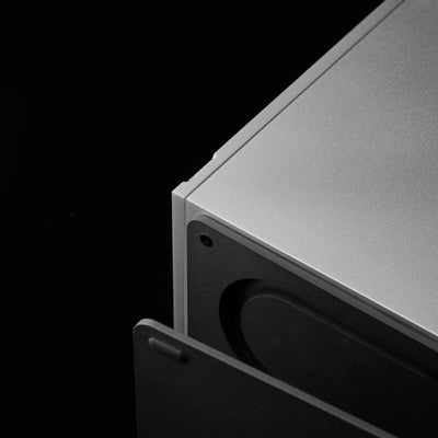 Concealed passive radiator beneath the silver SOVOX MiniMax3 Monitor cabinet